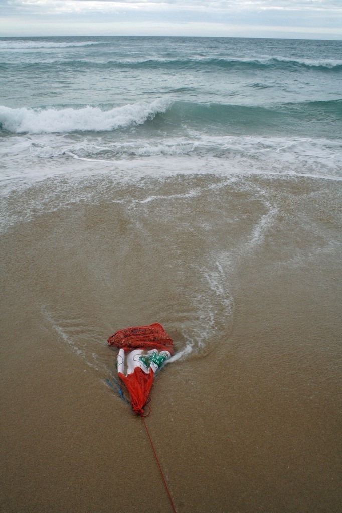 An onion bag is the best way to use berley when surf fishing. These can be filled with tuna oiled pellets and staked off in the sand. The waves will do all the work. - Jarrod Day © Jarrod Day