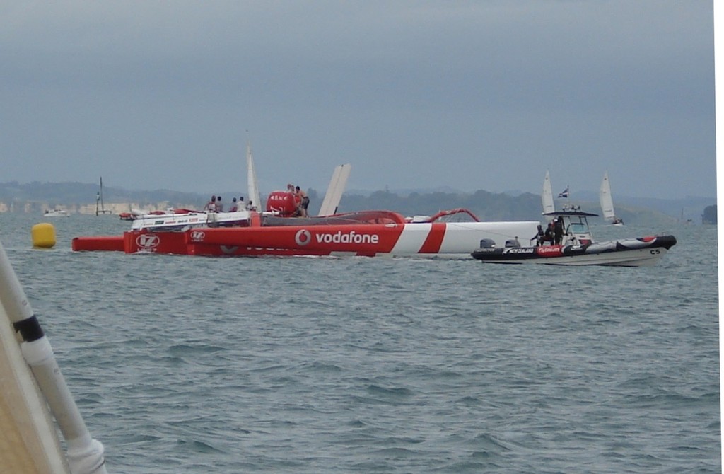 Dismasted Team Vodafone Sailing with ETNZ tenders assisting - Team Vodafone Sailing photo copyright Colin Preston taken at  and featuring the  class