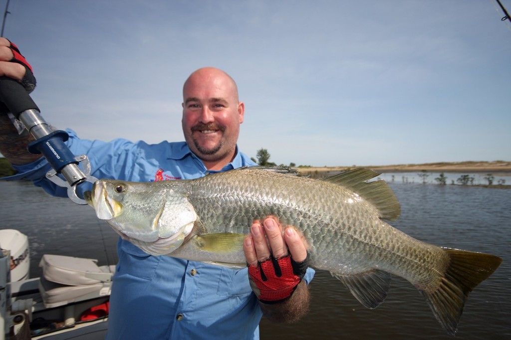 Big Benny displays a solid Barra from the Blyth River. © Jarrod Day