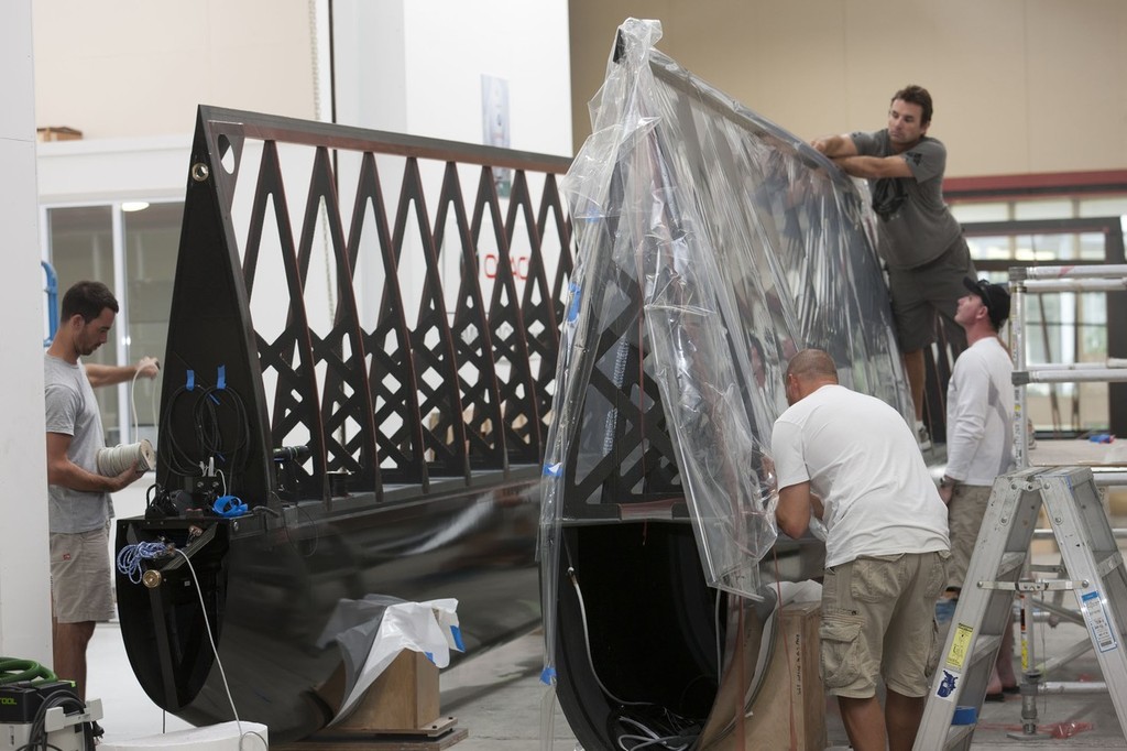 Sailing crew help assembling team AC45 and its wing   © Gilles Martin-Raget / Oracle Racing