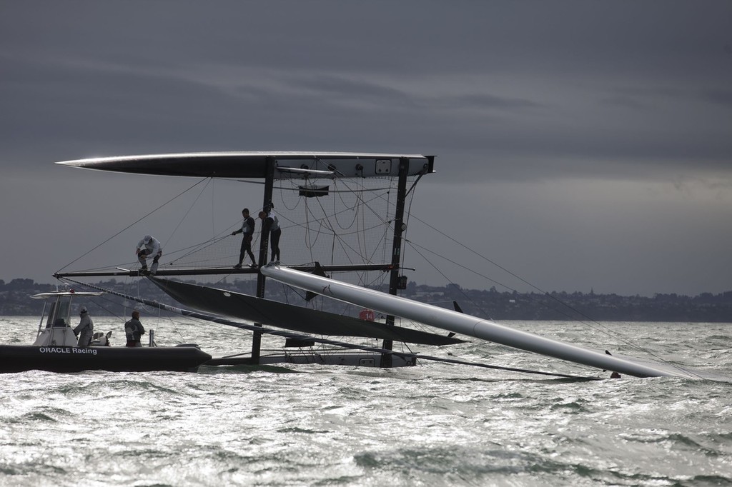 25/04/2011 - Auckland (NZL) - 34th America’s Cup - AC45 test event - Day 1 - Oracle 1 capsize and redress © OracleTeam USA www.oracleracing.com