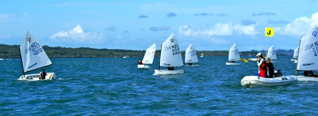 Third overall Nathaniel Deverell 4212 is called out by the on the water judges soon after the start of Race 5 on Day 3 of the 2011 Toyota Optimist Nationals © Richard Gladwell www.photosport.co.nz