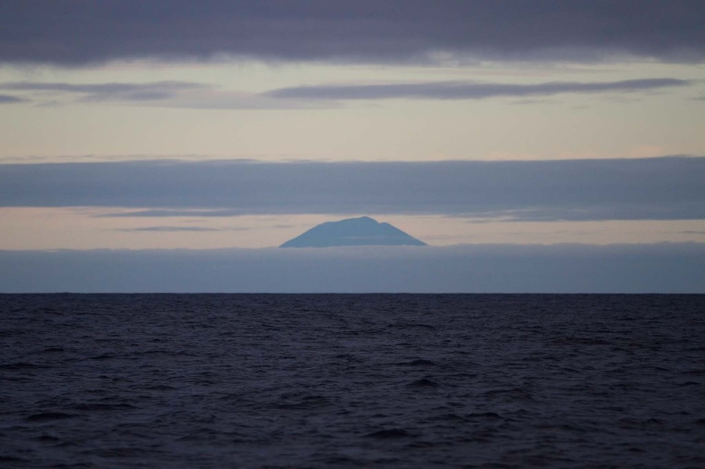 Land Ho! Tristan da Cunha on the horizon just before nightfall. PUMA Ocean Racing powered by BERG is dismasted in the South Atlantic Ocean during Leg 1 of the Volvo Ocean Race 2011-12, from Alicante, Spain to Cape Town, South Africa. (Credit: Amory Ross/PUMA Ocean Racing/Volvo Ocean Race) photo copyright Amory Ross/Puma Ocean Racing/Volvo Ocean Race http://www.puma.com/sailing taken at  and featuring the  class