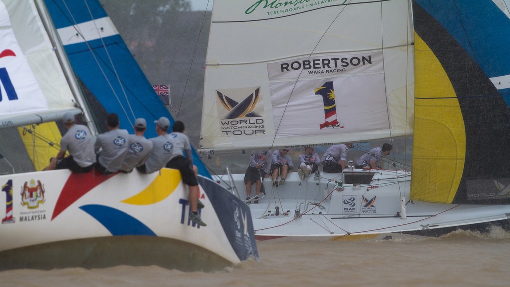 Phil Robertson crosses ahead of Ian Williams on day 3 at the Monsoon Cup 2011. Kuala Terengannu, Malaysia. 25 November 2011.  &copy; Gareth Cooke/Subzero Images/ Monsoon Cup - copyright http://www.monsooncup.com.my