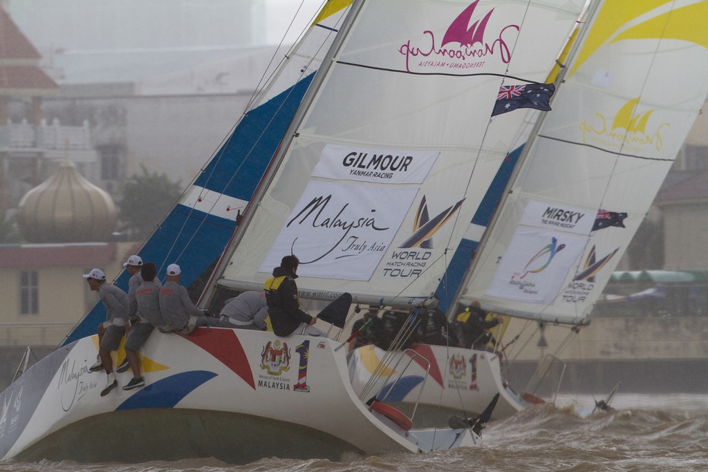 Torvar Mirsky and Peter Gilmour in a critical match as a strong squall descends on the race course on day 3 at the Monsoon Cup 2011. Kuala Terengannu, Malaysia. photo copyright Gareth Cooke/Subzero Images/ Monsoon Cup - copyright http://www.monsooncup.com.my taken at  and featuring the  class