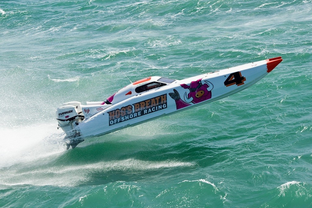 'Hogs Breath' flies high off Mackay and is intend on making things tough Supercat Outboatd Lite class leader 'FGI'. - Redcliffe Offshore Race photo copyright Andrew Gricks http://www.andrewgricksphotography.com taken at  and featuring the  class