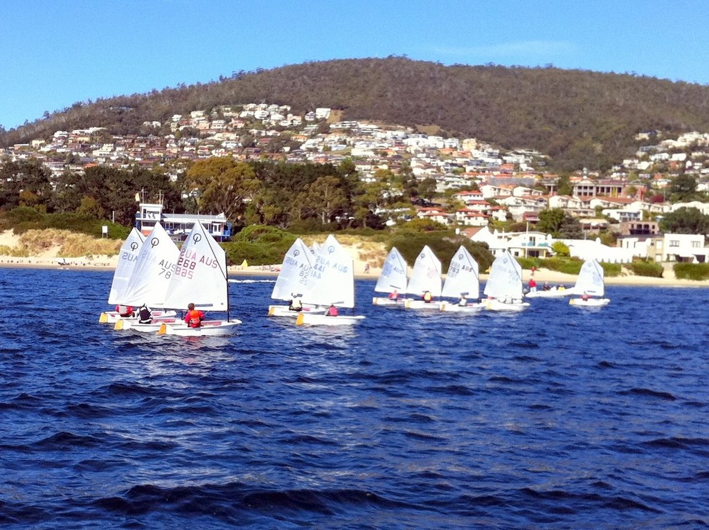 Optimists contesting their Tasmanian championship off Nutgrove Beach, Sandy Bay, today - Tasmanian sailing championships photo copyright Nick Connor taken at  and featuring the  class