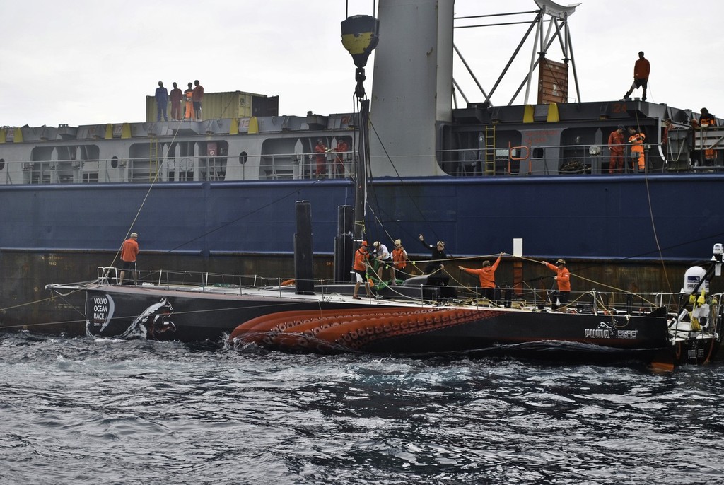 PUMA Ocean Racing powered by BERG is loaded onto a container ship just off the island of Tristan da Cunha to go to Cape Town, South Africa. (Credit: Tristan da Cunha) photo copyright Amory Ross/Puma Ocean Racing/Volvo Ocean Race http://www.puma.com/sailing taken at  and featuring the  class