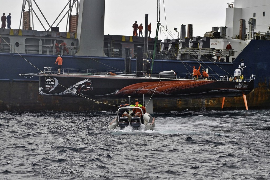 PUMA Ocean Racing powered by BERG is loaded onto a container ship just off the island of Tristan da Cunha to go to Cape Town, South Africa.  © Amory Ross/Puma Ocean Racing/Volvo Ocean Race http://www.puma.com/sailing