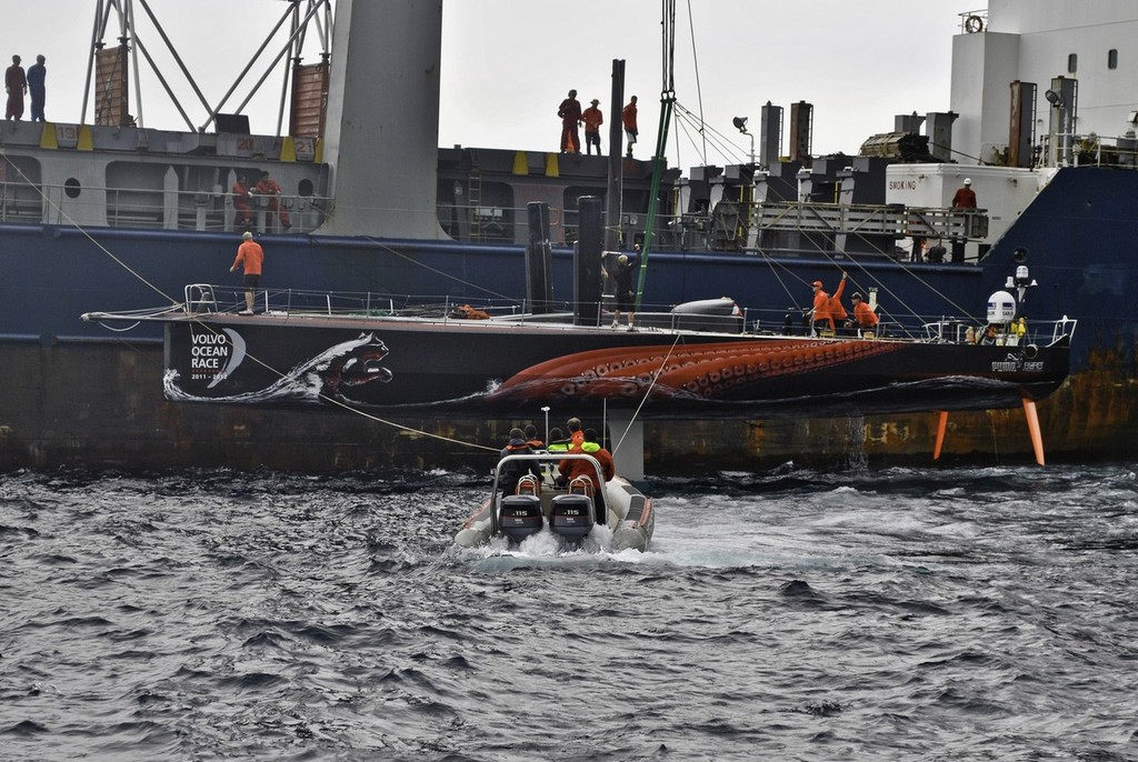 PUMA Ocean Racing powered by BERG is loaded onto a container ship just off the island of Tristan da Cunha to go to Cape Town, South Africa. (Credit: Tristan da Cunha) photo copyright Amory Ross/Puma Ocean Racing/Volvo Ocean Race http://www.puma.com/sailing taken at  and featuring the  class