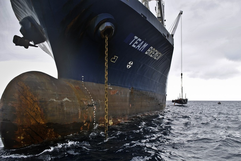 PUMA Ocean Racing powered by BERG is loaded onto a container ship just off the island of Tristan da Cunha to go to Cape Town, South Africa. (Credit: Tristan da Cunha) © Amory Ross/Puma Ocean Racing/Volvo Ocean Race http://www.puma.com/sailing