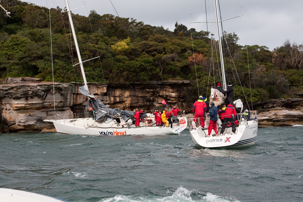 Patrice Six assists You're Hired off the rocks at Steel Point - Audi Winter Series Race 2011 photo copyright www.SailPix.com.au http://www.SailPix.com.au taken at  and featuring the  class