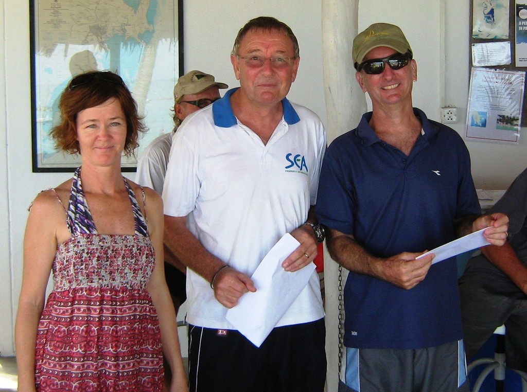 Winner of the Bel Air Panwa Tasar Series Andrew de Bruin (right) receiving his prize from Phuket Yacht Club Commodore Peter Dyer (centre) and Club Secretary Donna Stephens (left). photo copyright Duncan Worthington taken at  and featuring the  class