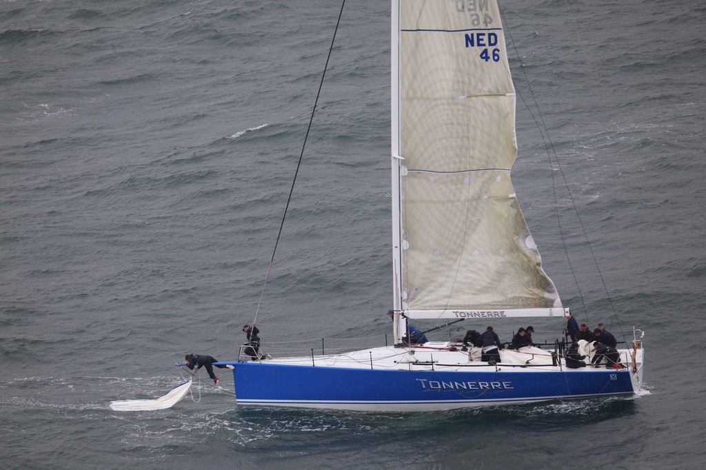 Tonnerre De Breskens 3 clears away the remains of a ripped sail before continuing in the J.P. Morgan Asset Management Round the Island Race. photo copyright TH Martinez/Sea&Co/onEdition taken at  and featuring the  class