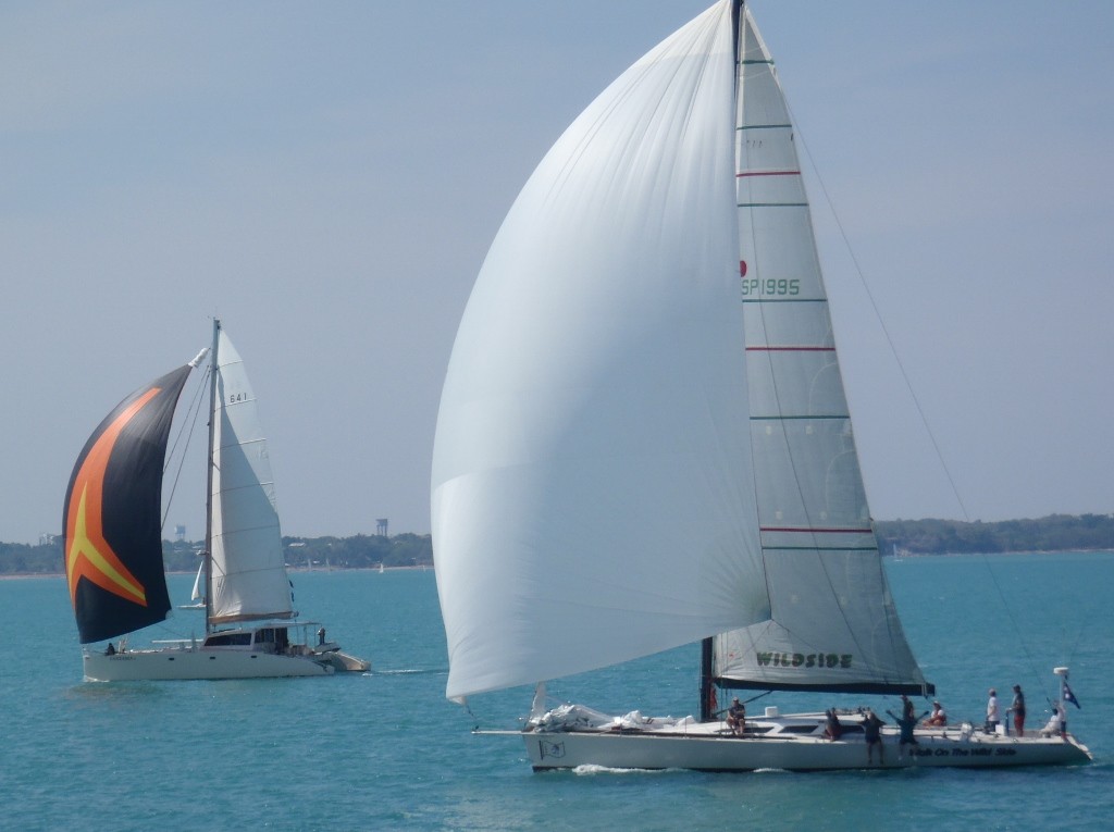 Fantasia and Walk on the Wildside leading the fleet out Darwin Harbour for Ambon - Darwin to Ambon Yacht Race & Rally 2011 photo copyright Robyn Dix taken at  and featuring the  class