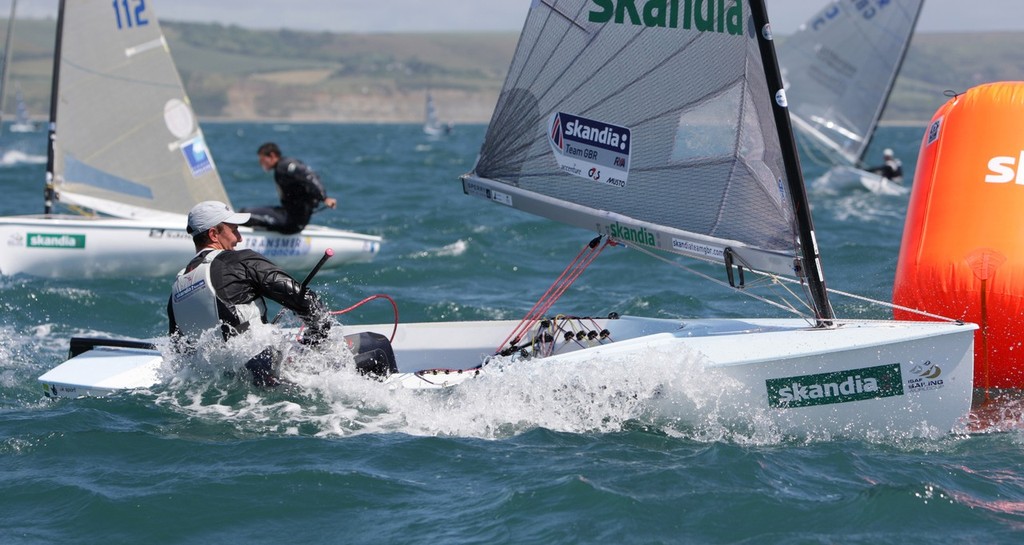 Giles Scott from Great Britain racing racing in the Finn class on day 3 of the Skandia Sail for Gold Regatta, in Weymouth © onEdition http://www.onEdition.com