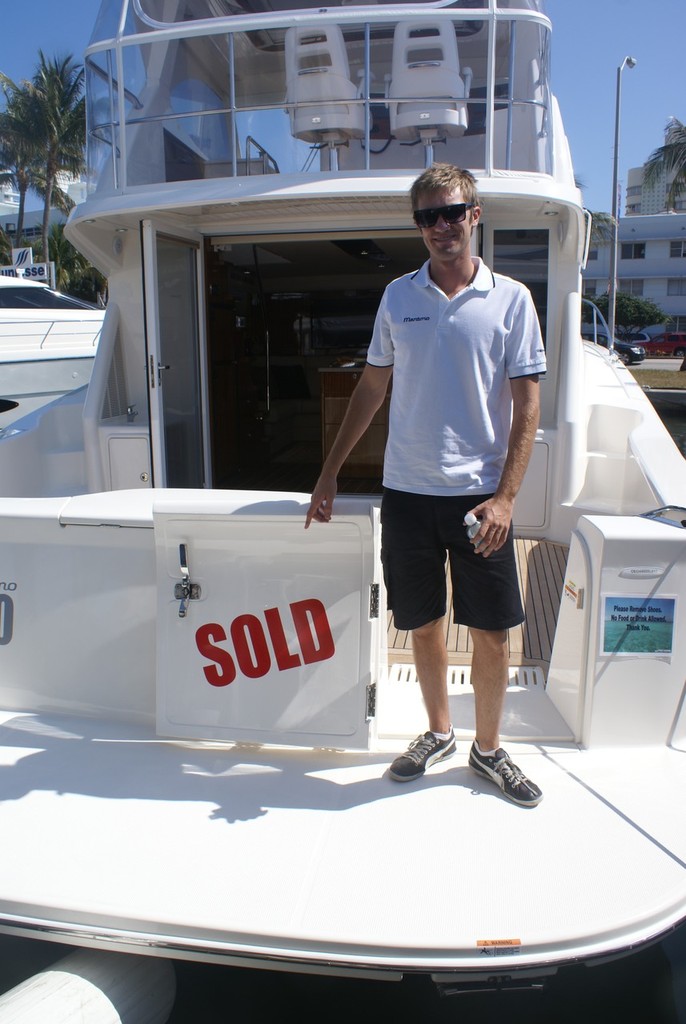 &rsquo;Sold&rsquo; sign puts a smile on the face of Tom Barry-Cotter. photo copyright Bob Wonders taken at  and featuring the  class