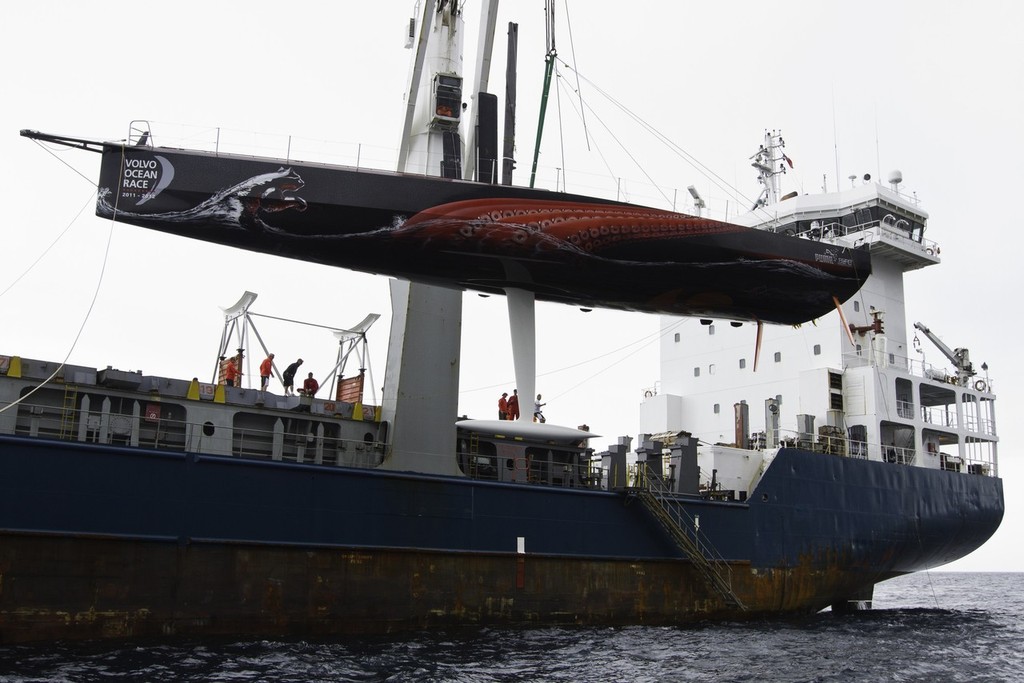 PUMA Ocean Racing powered by BERG Propulsion’s mar mostro is loaded onto the container ship Team Bremen, just off the island of Tristan da Cunha, ready for the trip back to Cape Town, South Africa to join the rest of the Volvo Ocean Race 2011-12 fleet for the start of leg 2.  © Amory Ross/Puma Ocean Racing/Volvo Ocean Race http://www.puma.com/sailing