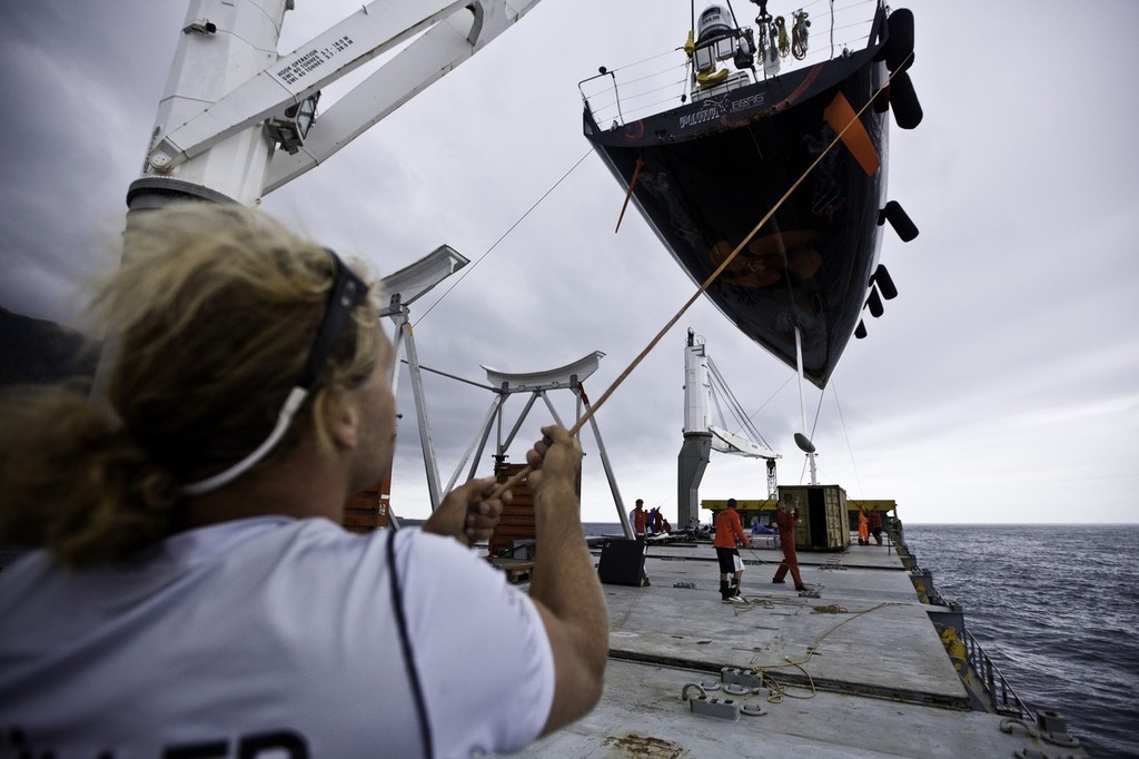 PUMA Ocean Racing powered by BERG Propulsion's mar mostro is loaded onto the container ship Team Bremen, just off the island of Tristan da Cunha, ready for the trip back to Cape Town, South Africa to join the rest of the Volvo Ocean Race 2011-12 fleet for the start of leg 2. (Credit: Amory Ross/PUMA Ocean Racing/Volvo Ocean Race) photo copyright Amory Ross/Puma Ocean Racing/Volvo Ocean Race http://www.puma.com/sailing taken at  and featuring the  class