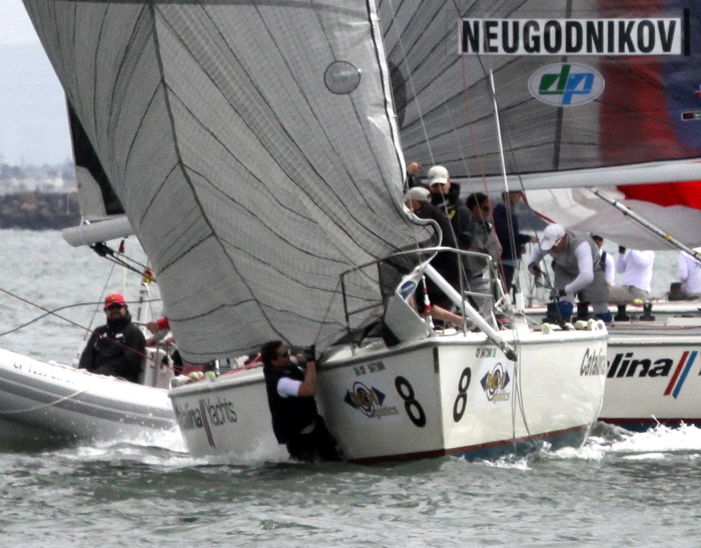 Tactician Nils Bjerkas slipped overboard as Staffan Lindberg spun the boat around the end of the finish line to beat Evgeny Neugodnikov - Congressional Cup - Long Beach YC - Day 2 © Rich Roberts http://www.UnderTheSunPhotos.com