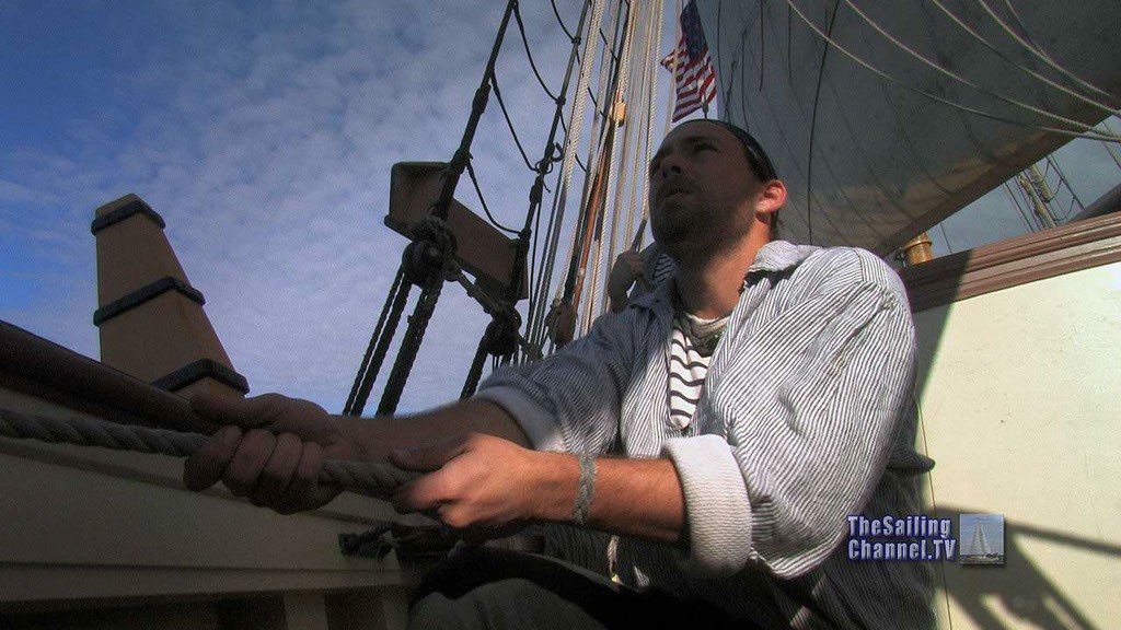 Deck hand of Tall Ship: The Privateer Lynx hauls in on a line to trim sail - HD Video Stills from the documentary © Robert Margouleff