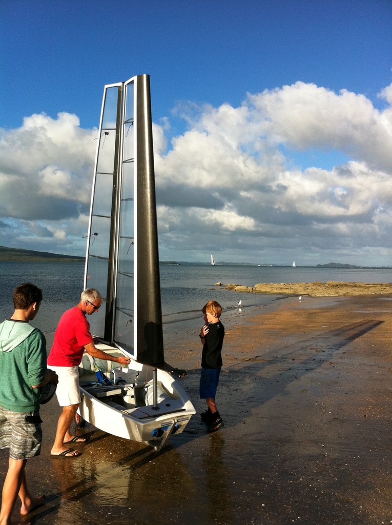 Mike Drummond checks the wingsailed Optimist - Toyota Optimist Nationals 2011. Image: Nick Glanfield © SW