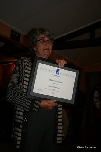 Isobel Jennings poses with her framed YNZ Service Award © Karen Bruce