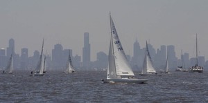 Lawrie Smith and crew approach the line, with Melbourne's CBD in the background - Dragon World Championship photo copyright  John Curnow taken at  and featuring the  class