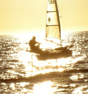 Pure Gold - Phil ``Bugs`` Smith's Moth challenges the setting sun for star status. - Mandurah Easter Regatta photo copyright Lorenzo del Flynnio taken at  and featuring the  class