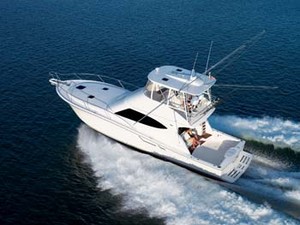 Easy at the helm, Tiara 4800 Convertible tops out at a speedy 36 knots. photo copyright Tiara Yachts taken at  and featuring the  class