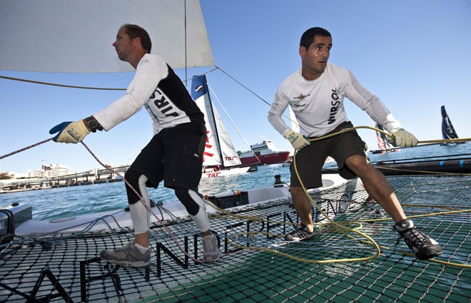 Anton Paz and Tom Buggy working hard on Team Extreme in the light airs - Extreme Sailing Series 2011 Act 8 &copy; Lloyd Images http://lloydimagesgallery.photoshelter.com/
