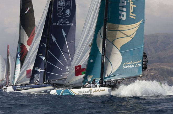 Oman Air racing with plumes of spray behind them<br />
 - Extreme Sailing Series Act 8 2011 © Lloyd Images http://lloydimagesgallery.photoshelter.com/