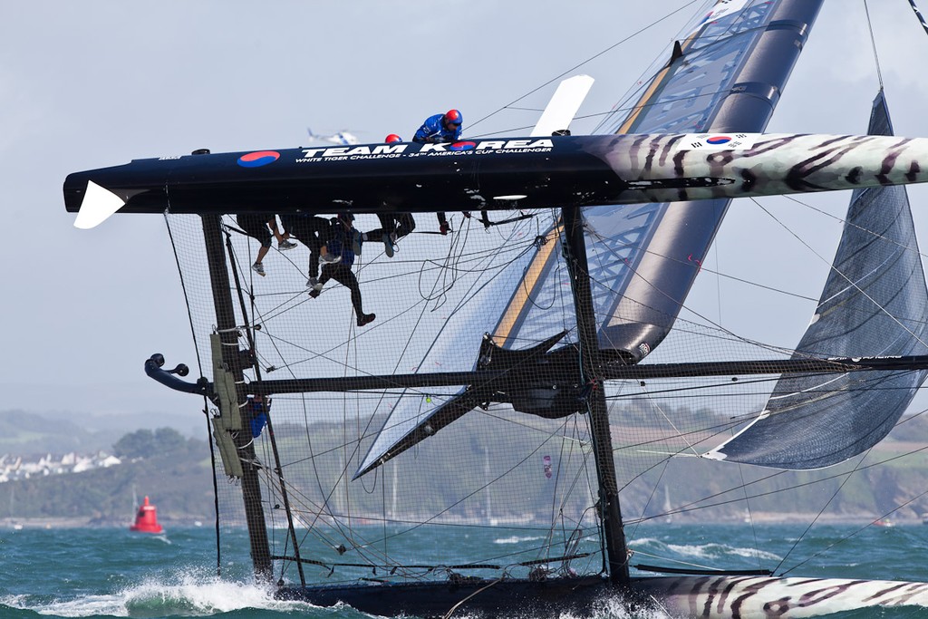 Team Korea capsizing at the top mark - America’s Cup World Series Plymouth 2011 © Sander van der Borch http://www.sandervanderborch.com