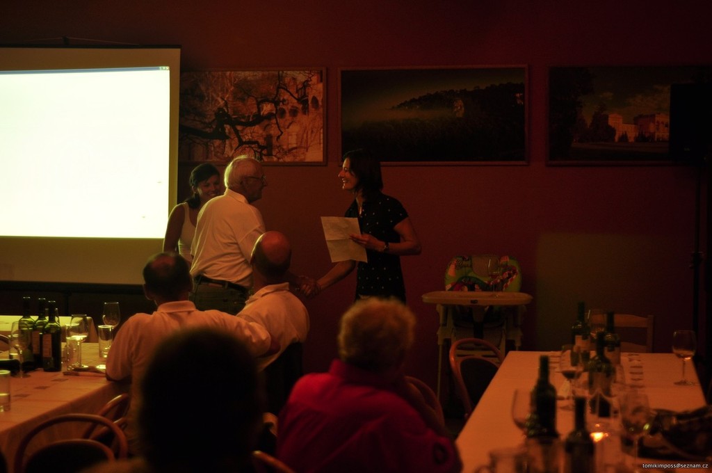 Organising and competitor Jana Bezuskova presenting oldest competitor Helmut a goodies bag at the sailors' dinner on Friday - Europe Dinghy Veteran World Cup 2011 photo copyright Andy Greager taken at  and featuring the  class