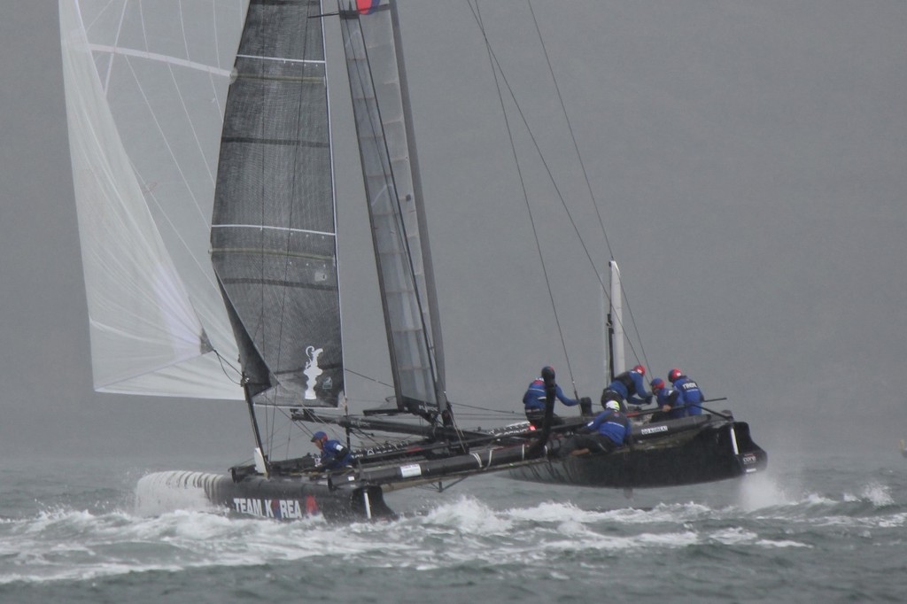 The sea and the sky become one as Team Korea head off into the murk - America’s Cup World Series - Day 6, 17 September 2011 © Ben Gladwell http://www.sail-world.com/nz