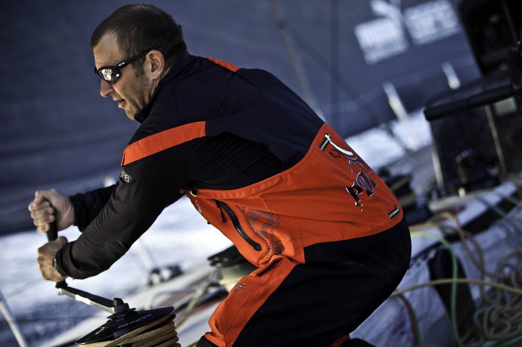 Ryan Godfrey trimming the inboard sheet of the Code-0. PUMA Ocean Racing powered by BERG during leg 1 of the Volvo Ocean Race 2011-12, from Alicante, Spain to Cape Town, South Africa. © Amory Ross/Puma Ocean Racing/Volvo Ocean Race http://www.puma.com/sailing