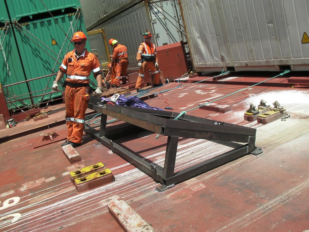 The angle of the deck makes standing up a challenge. - Rena - 21 October 2011 © Maritime NZ www.maritimenz.govt.nz