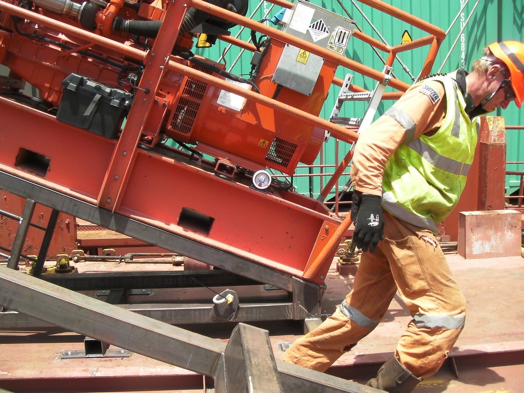 A member of the salvage team with some of the pumping equipment installed aboard Rena. - Rena - 21 October 2011 photo copyright Maritime NZ www.maritimenz.govt.nz taken at  and featuring the  class