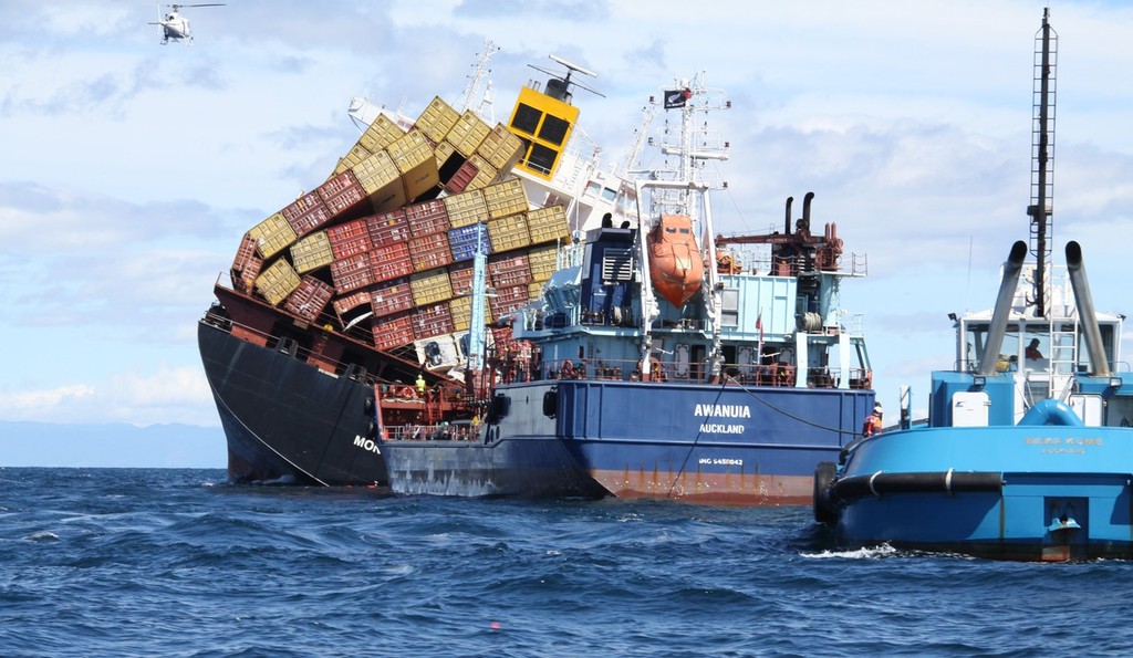 The Ports of Auckland tug Waka Kume helps position the oil tanker Awanuia to the stern of the stricken container vessel Rena, ready for oil to be pumped from Rena. - Rena - 21 October 2011 © Maritime NZ www.maritimenz.govt.nz