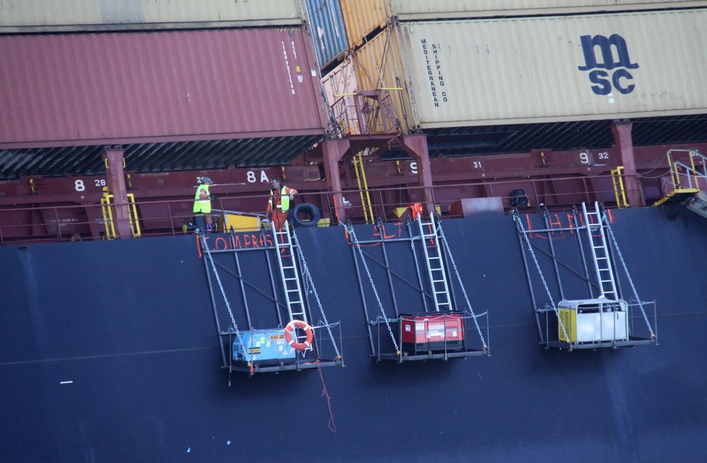 Temporary stages have been attached to the side of the grounded container ship Rena to take men and equipment for the salvage operation. © Maritime NZ www.maritimenz.govt.nz