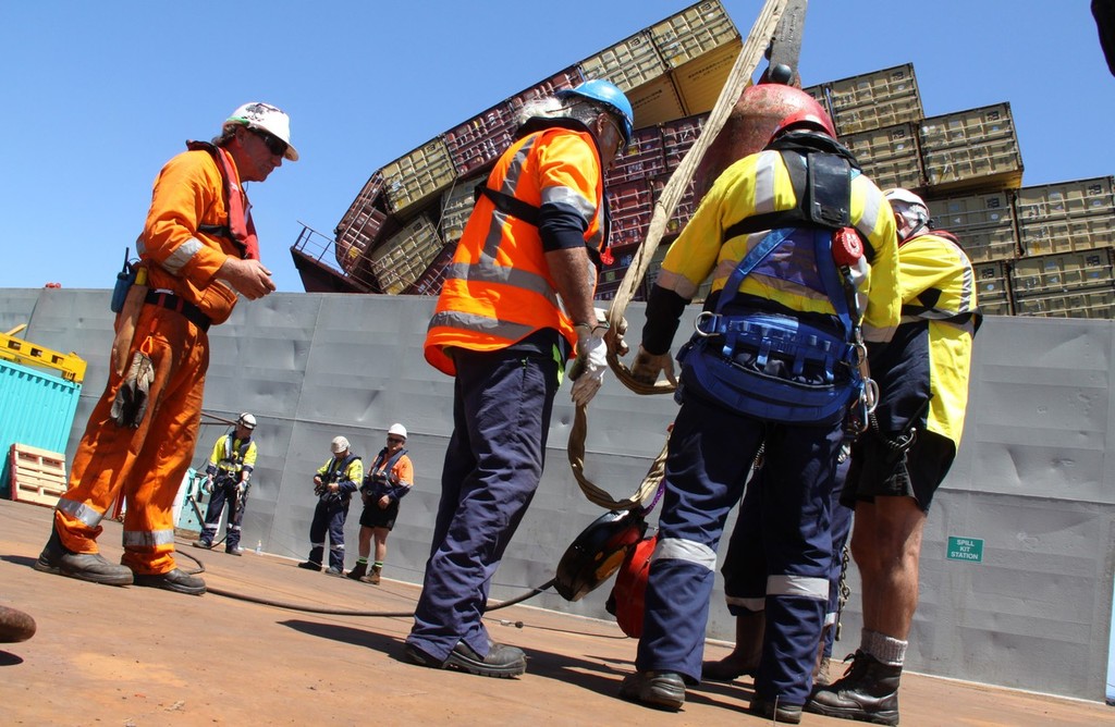 Sea Tow 60  - moving into position on Rena site to start lifting & removing containers with salvage crews sorting & reading gear for the lifts - Rena Disaster Photos: Graeme Brown  © Maritime NZ www.maritimenz.govt.nz