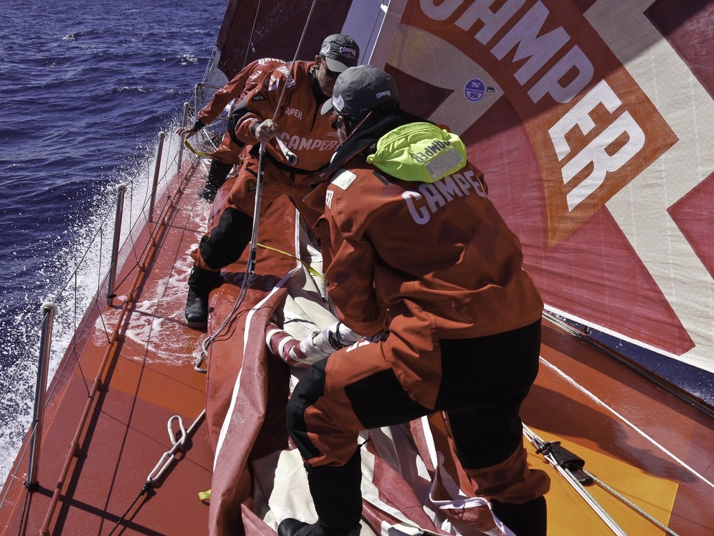 Skipper Chris Nicholson and Navigator Will Oxley prepare a sail to hoist on the foredeck of  CAMPER with Emirates Team New Zealand during leg 1 of the Volvo Ocean Race 2011-12, from Alicante, Spain to Cape Town, South Africa. (Credit: Hamish Hooper/CAMPER ETNZ/Volvo Ocean Race) photo copyright Hamish Hooper/Camper ETNZ/Volvo Ocean Race taken at  and featuring the  class