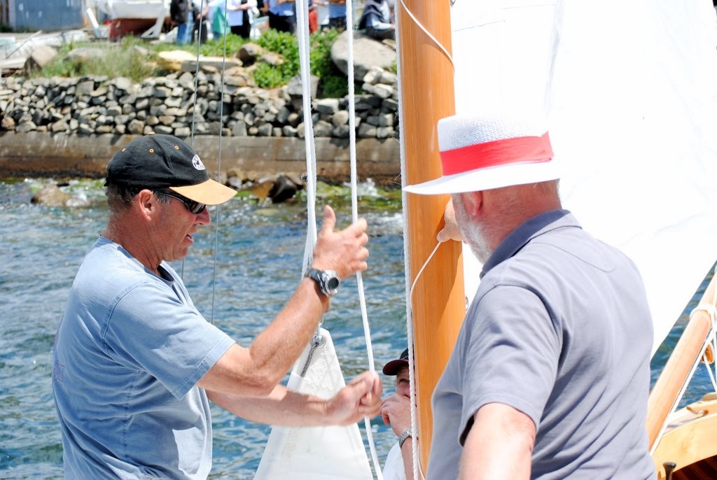 Tim Phillips, restorer and builder of Queenscliff ‘couta boats (left) sorts out the halyards of Darce with part-owner Robert Clifford photo copyright Rob Cruse taken at  and featuring the  class