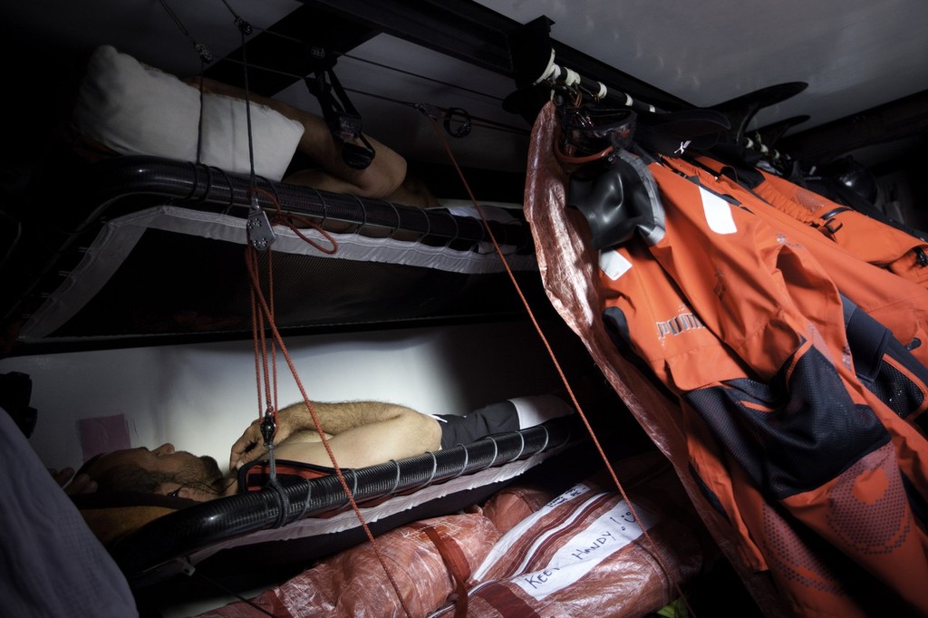 Ryan Godfrey taking a daytime nap with his iPod. Pums Ocean Racing powered by Berg during leg 1 of the Volvo Ocean Race 2011-12, from Alicante, Spain to Cape Town, South Africa.  © Amory Ross/Puma Ocean Racing/Volvo Ocean Race http://www.puma.com/sailing