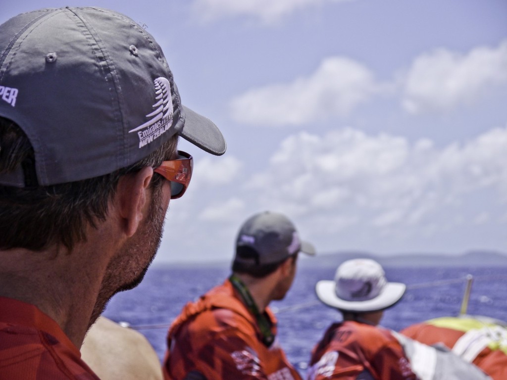 Chris Nicholson steers the boat on the approach to Fernando de Noronha on Camper with Emirates Team New Zealand during leg 1 of the Volvo Ocean Race 2011-12, from Alicante, Spain to Cape Town, South Africa.  © Hamish Hooper/Camper ETNZ/Volvo Ocean Race