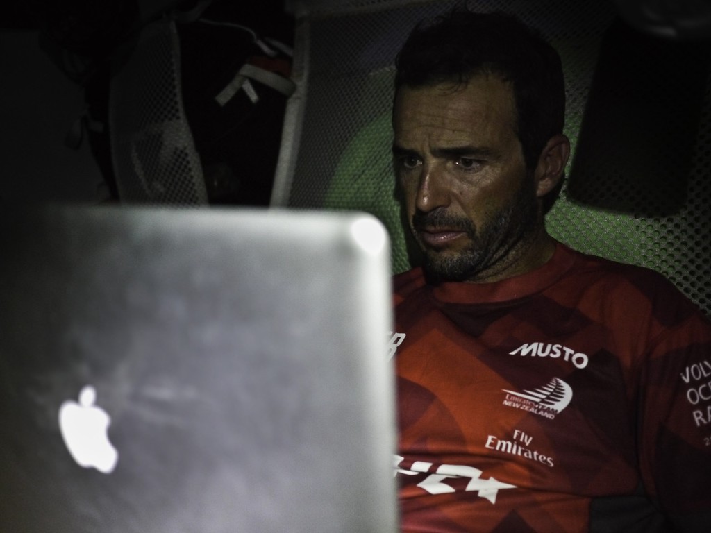 Roberto Bermudez Decastro does some writing in his offwatch onboard CAMPER with Emirates Team New Zealand during leg 1 of the Volvo Ocean Race 2011-12, from Alicante, Spain to Cape Town, South Africa.  © Hamish Hooper/Camper ETNZ/Volvo Ocean Race