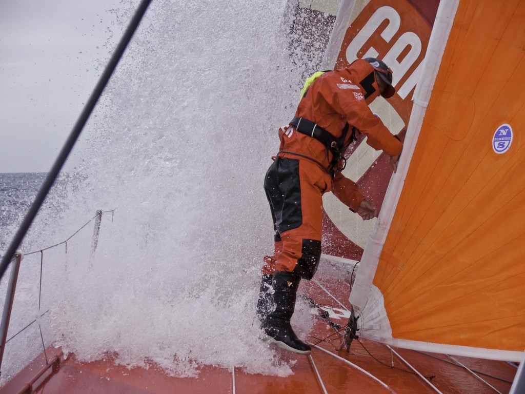 Skipper Chris Nicholson checks over the foredeck onboard CAMPER with Emirates Team New Zealand during leg 1 of the Volvo Ocean Race 2011-12 © Hamish Hooper/Camper ETNZ/Volvo Ocean Race