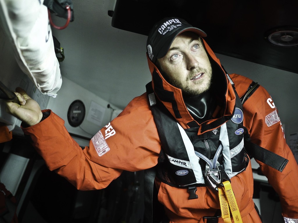 Andy McLean takes a pensive look out the hatch before going out into the cold onboard CAMPER with Emirates Team New Zealand  © Hamish Hooper/Camper ETNZ/Volvo Ocean Race