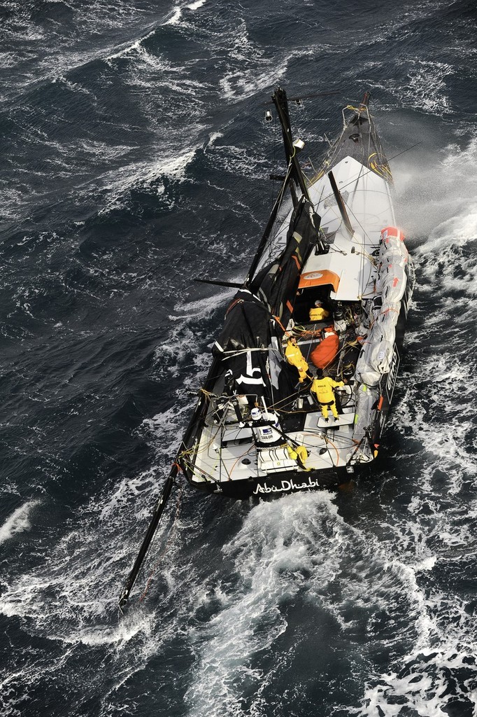 Abu Dhabi Ocean Racing’s yacht Azzam, skippered by Britain’s Ian Walker, returns to Alicante, Spain after the mast broke in rough weather on the first day of racing on leg 1 of the Volvo Ocean Race 2011-12.  © Paul Todd/Volvo Ocean Race http://www.volvooceanrace.com