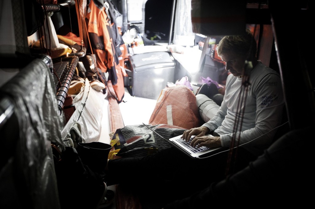 Ken Read at the computer while motoring to Tristan island under jury rig. Puma is dismasted in the South Atlantic.  © Amory Ross/Puma Ocean Racing/Volvo Ocean Race http://www.puma.com/sailing